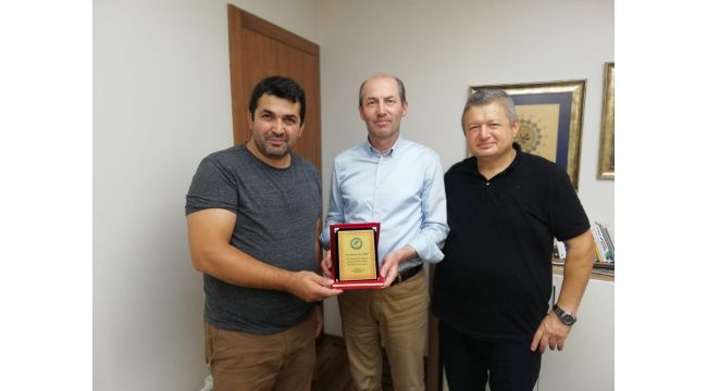 Ercan Özbay'a teşekkür plaketi