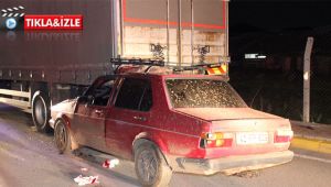 Kamyonun altına giren otomobildeki sürücü yaralandı