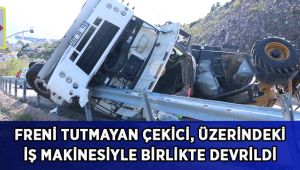 Freni tutmayan çekici, üzerindeki iş makinesiyle birlikte devrildi