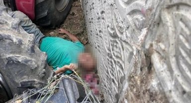 Kullandığı traktörün altında kalan çiftçi ağır yaralandı